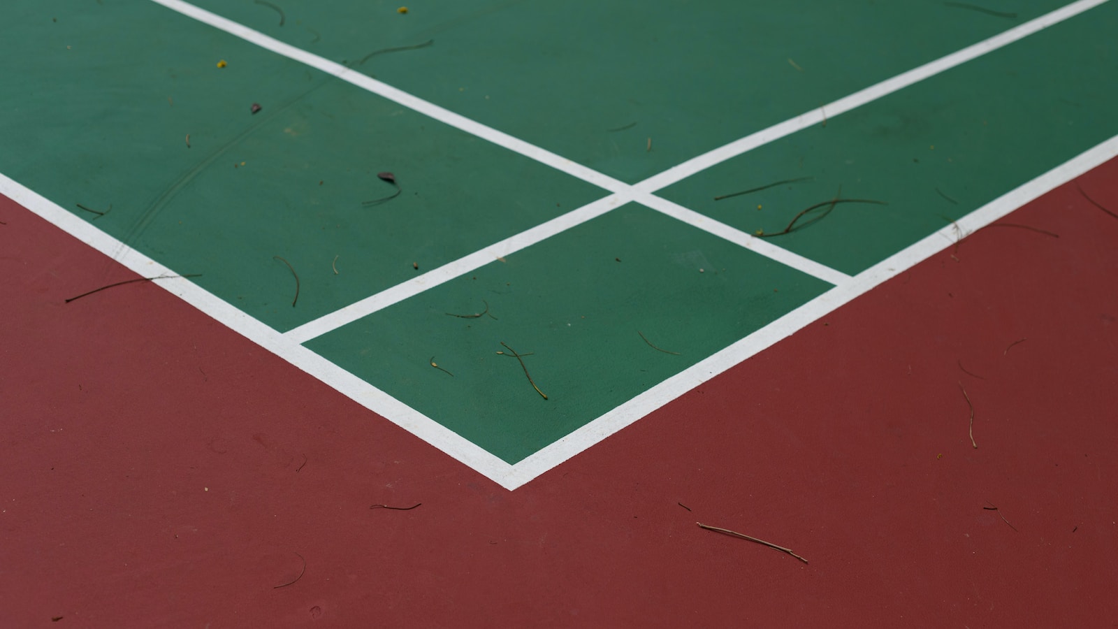 a tennis court with a red and green court