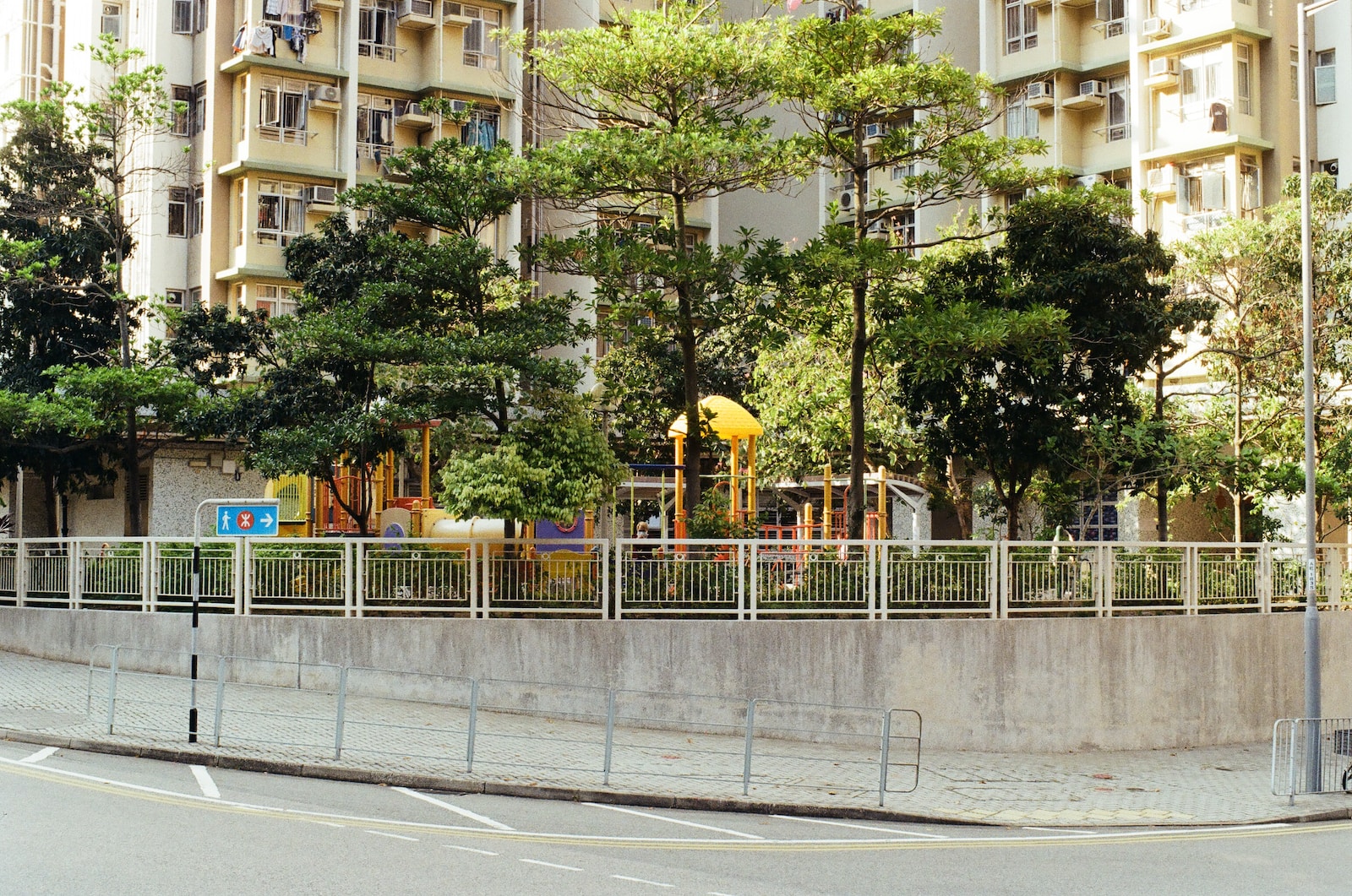 a large building with a playground in front of it