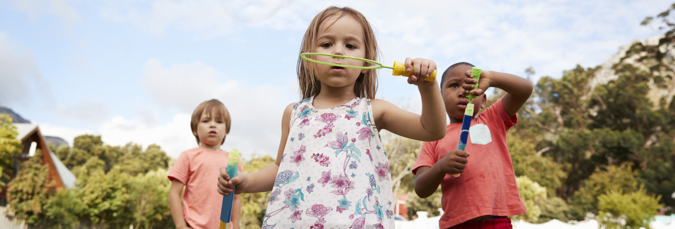 Children at montessori school playing with bubbles during break