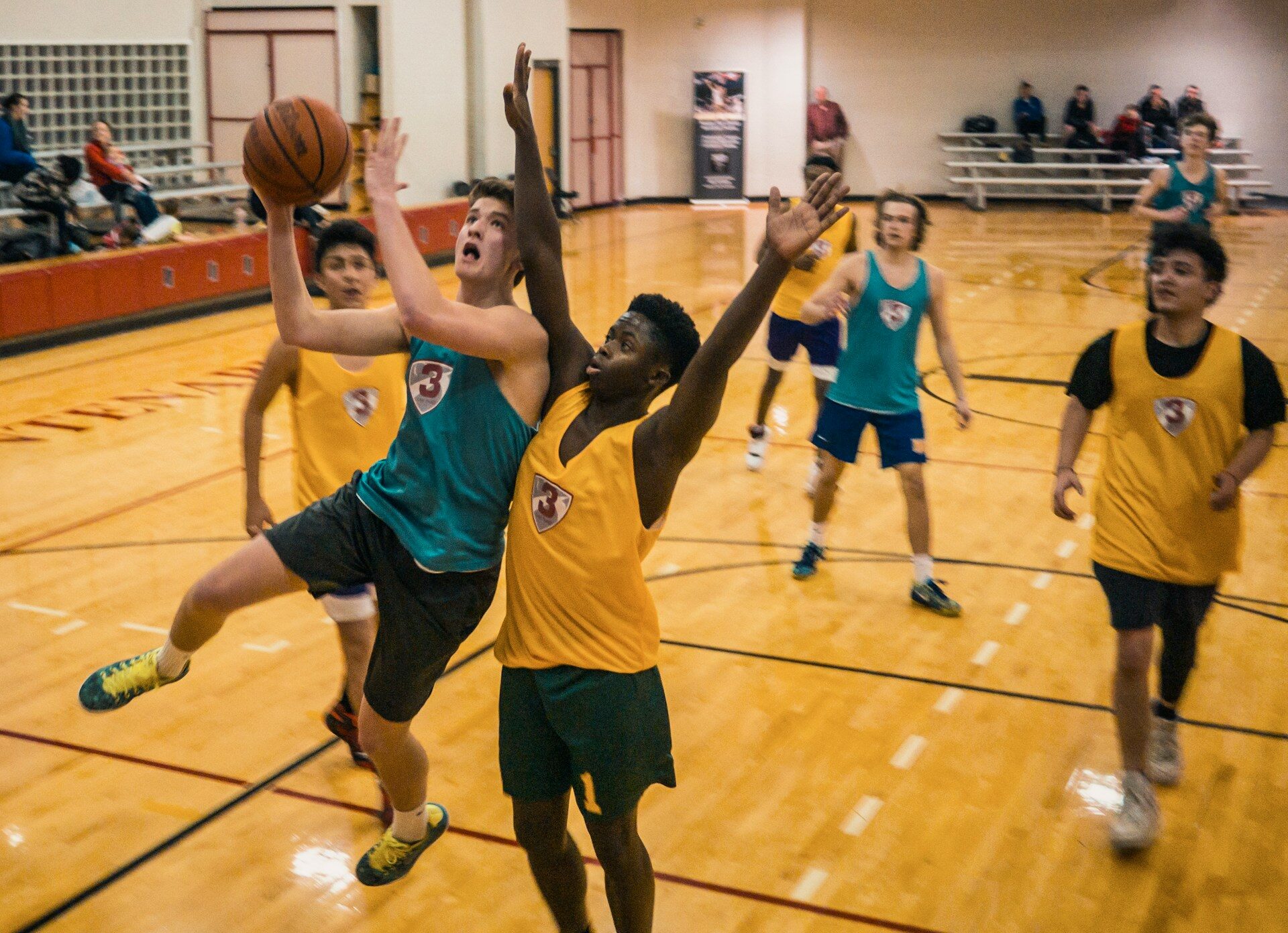 group of people playing basketball