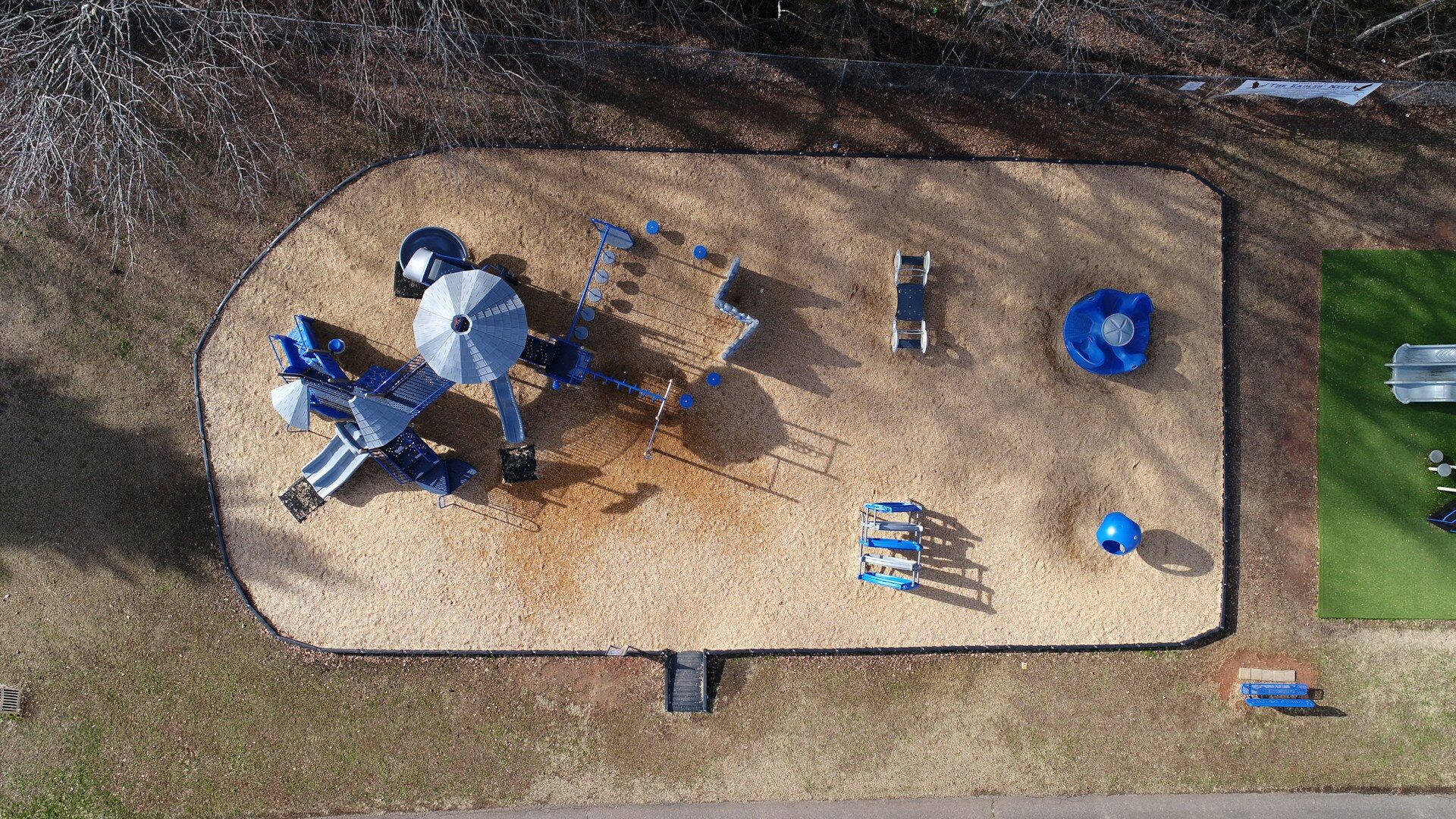 aerial photograph of toddler's park on sand