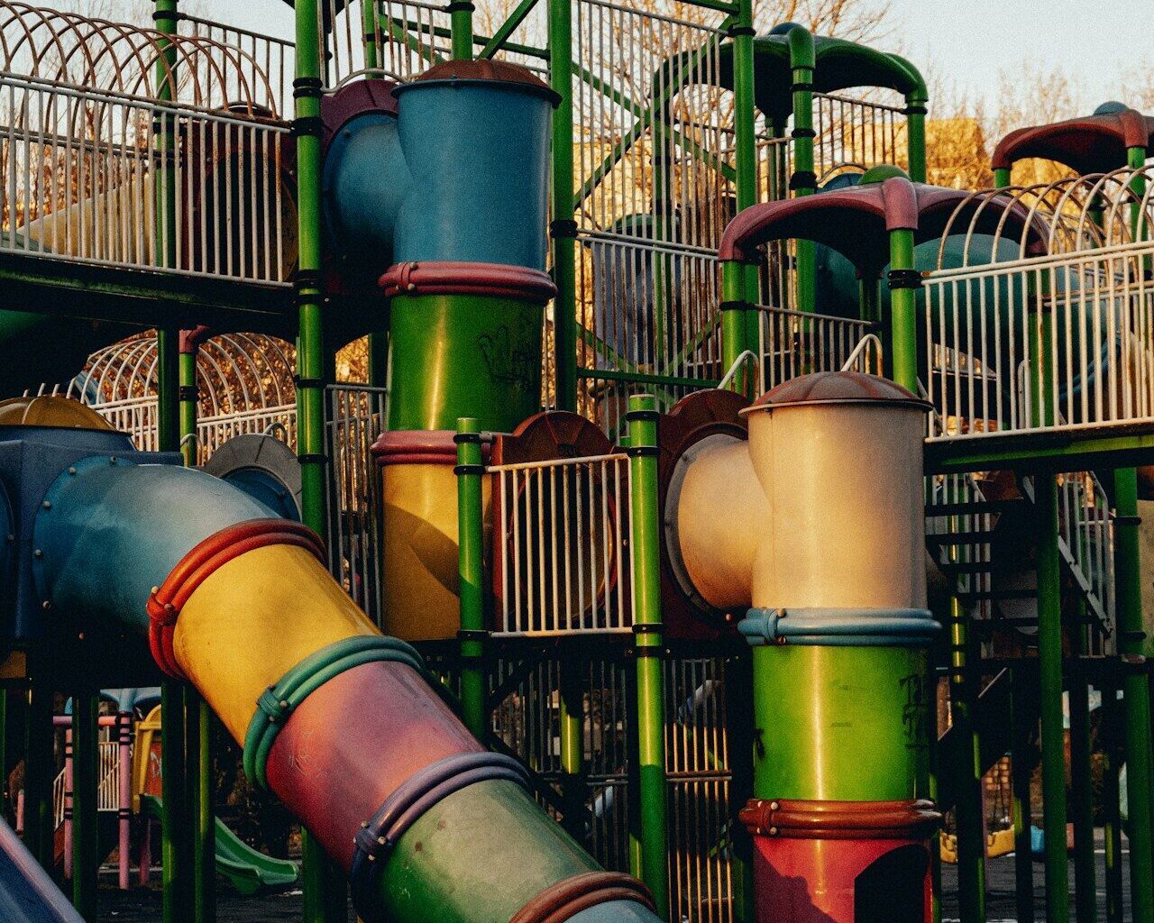 a playground with a slide and a play structure