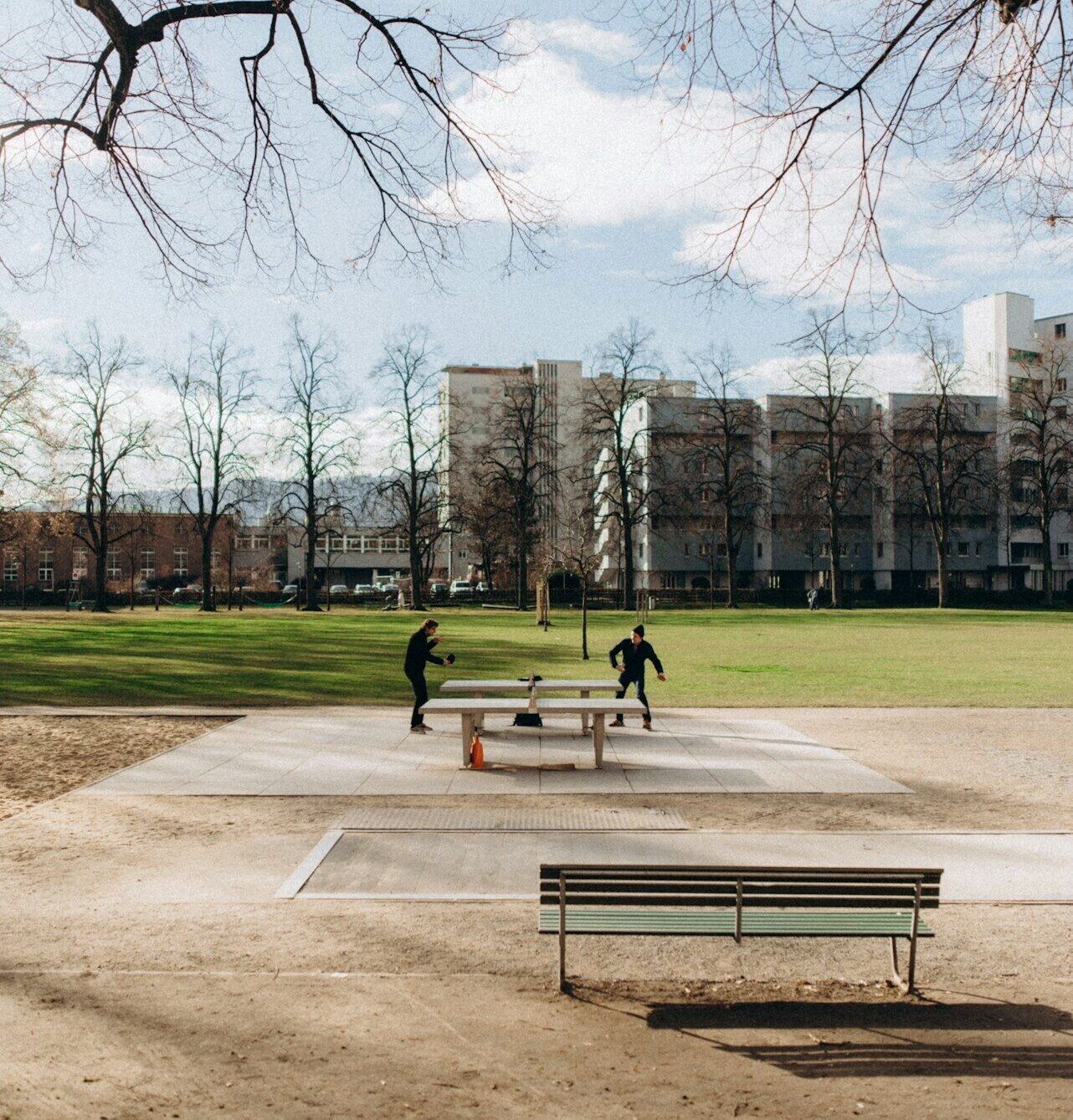 a group of people playing a game of baseball