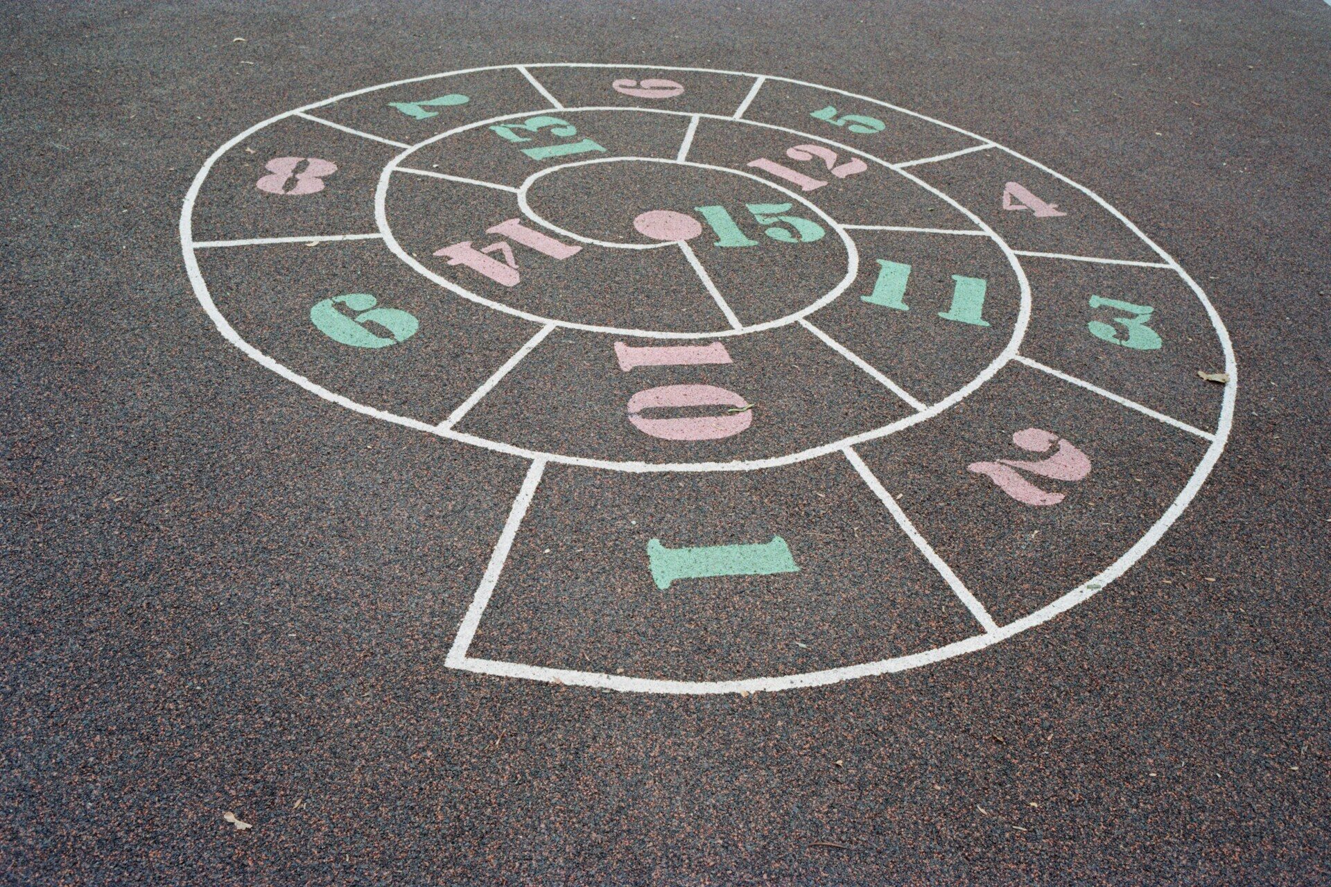a chalk drawing of a circle with numbers on it